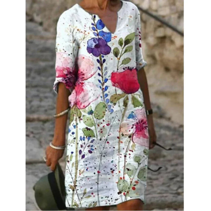 Back view of the women's floral midi dress, emphasizing the comfortable and stylish design.