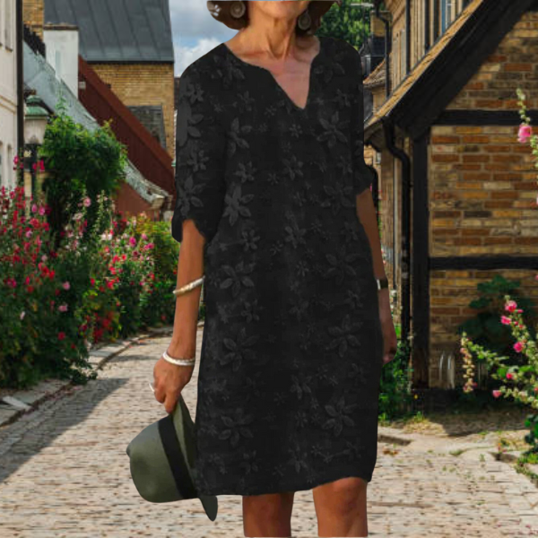 Elegant women's summer midi dress, featuring a vibrant floral print, V-neck, and practical pockets.
