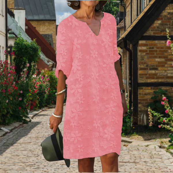 Comfortable women's shift midi dress with beautiful embroidered floral pattern, V-neck, and convenient pockets.