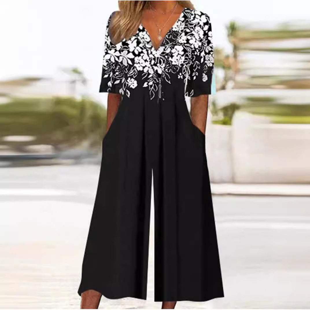 Stylish women's floral print wide leg jumpsuit with V-neck, elbow sleeves, ideal for bohemian fashion.