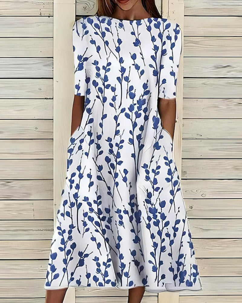 Women's flowy A-line midi dress with convenient pockets, perfect for casual summer wear. Features a comfortable style.
