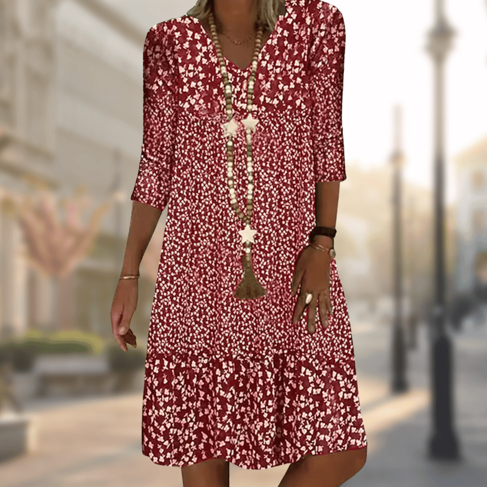 Elegant women's floral print tiered summer dress, ideal for vacation or spring fashion, offering comfortable, flowy style.