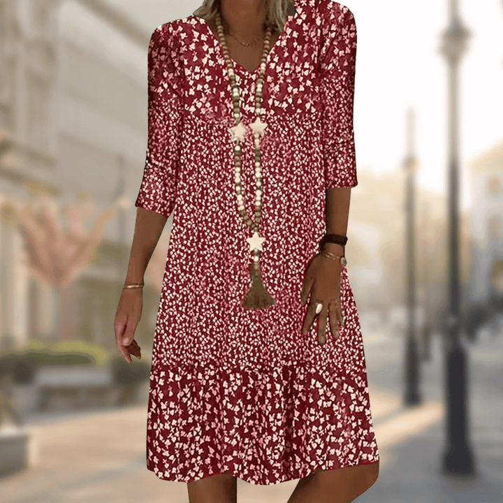 Elegant women's floral print tiered summer dress, ideal for vacation or spring fashion, offering comfortable, flowy style.
