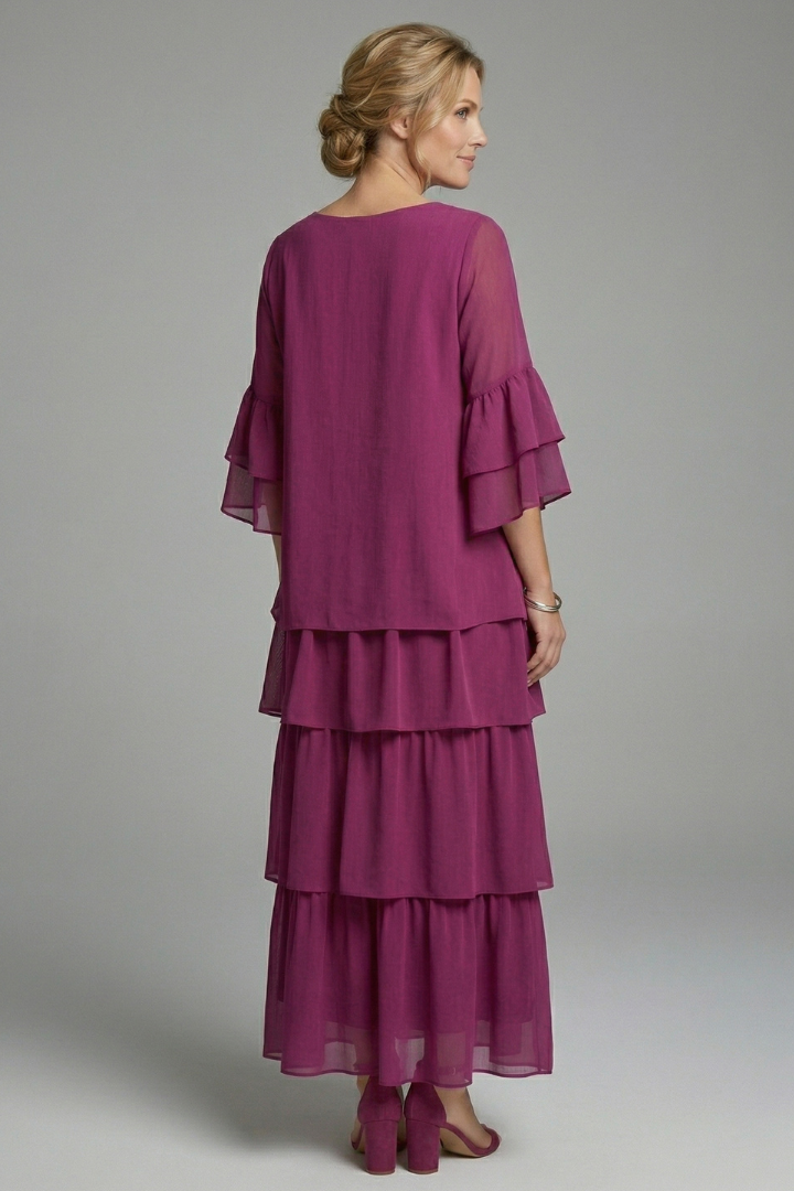 Elegant women's maxi dress featuring a flowy tiered skirt and round neck for summer.
