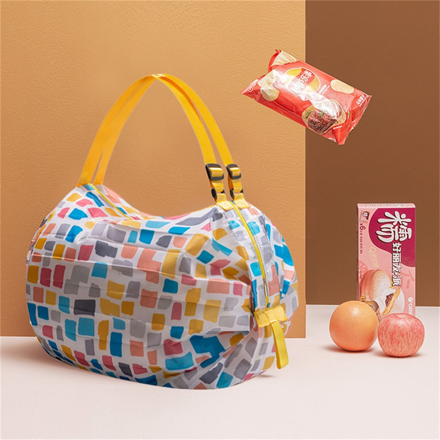 Compact, folded women's shopping tote in durable oxford fabric, ready for easy storage & travel.