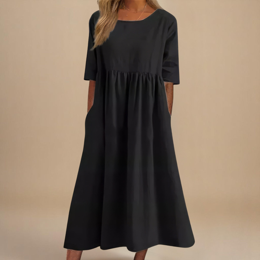 Versatile women's everyday midi dress with practical pockets and flattering gathered waist. Half-sleeves.