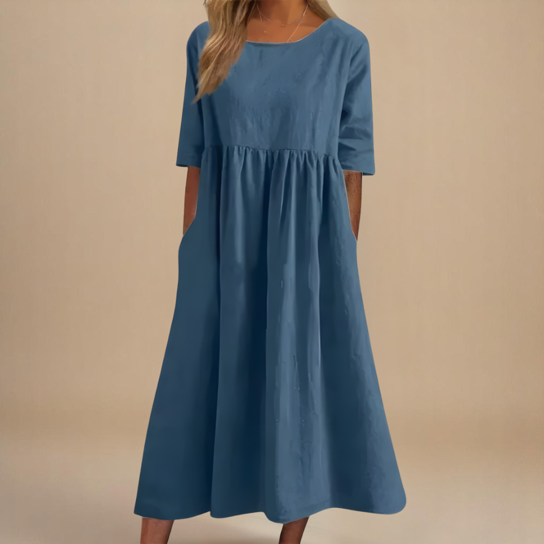 Ladies' A-line midi dress featuring a scoop neck, half-sleeves, and elegant gathered waist.