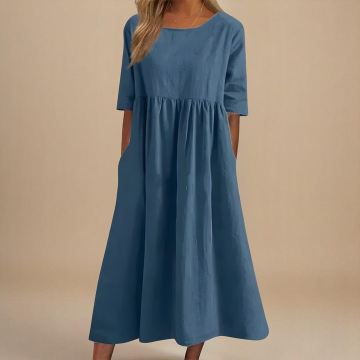 Ladies' A-line midi dress featuring a scoop neck, half-sleeves, and elegant gathered waist.