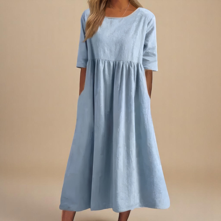 Relaxed fit women's half-sleeve midi dress, ideal for summer casual wear. Features a gathered waist.