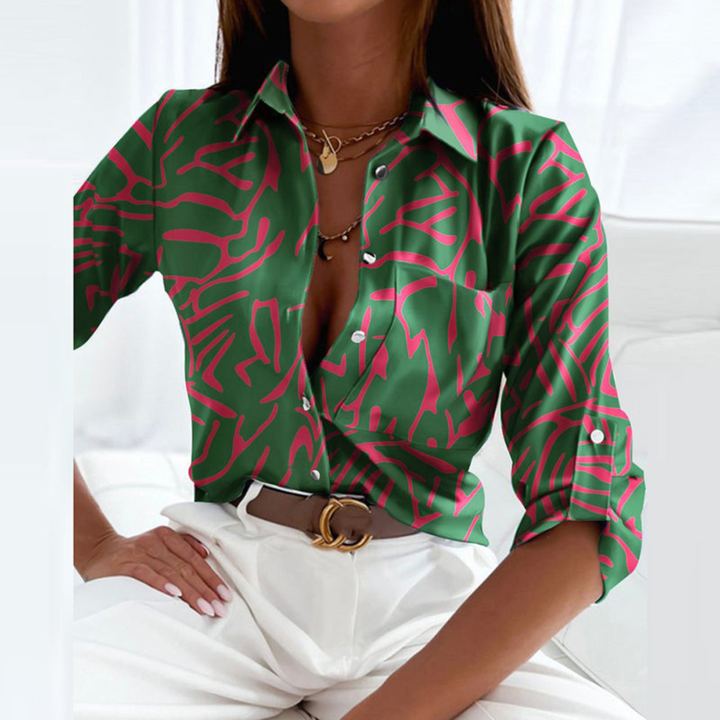 Women's fashion blouse, geometric print, button-down, a chic and elegant piece.