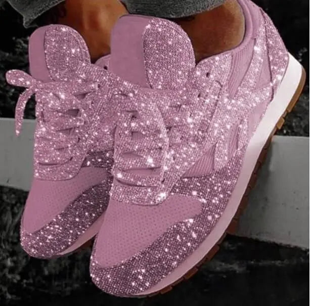 Women's glitter lace-up sneakers, sparkling finish for fashion & comfort. Trendy casual footwear.