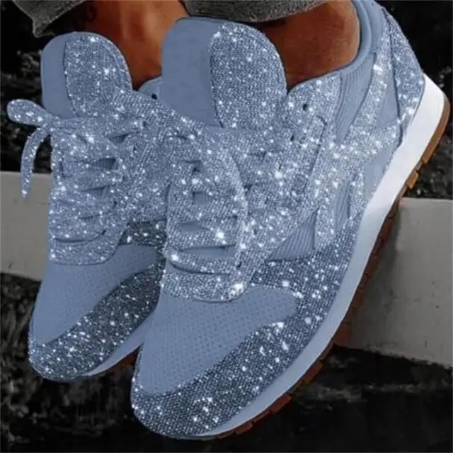 Stylish women's glitter sneakers with lace-up closure. Perfect sparkle shoes for casual outings or evening wear.