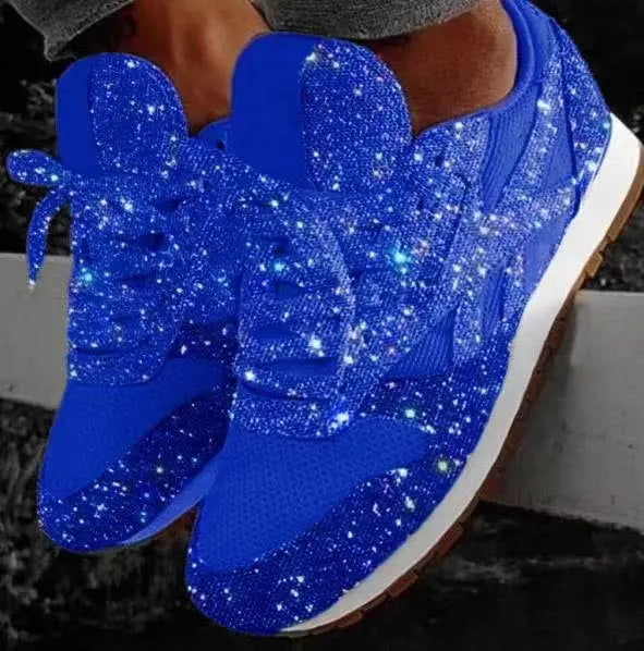 Front view of women's sparkling glitter lace-up sneakers. Trendy and comfortable footwear for a statement look.