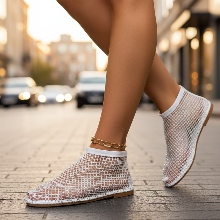 Women's dressy flats: secure instep strap, lavish glitter and rhinestone detailing.