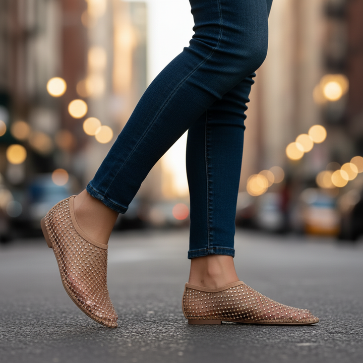 Sparkling women's flats with secure instep strap, detailed with glitter and rhinestones.
