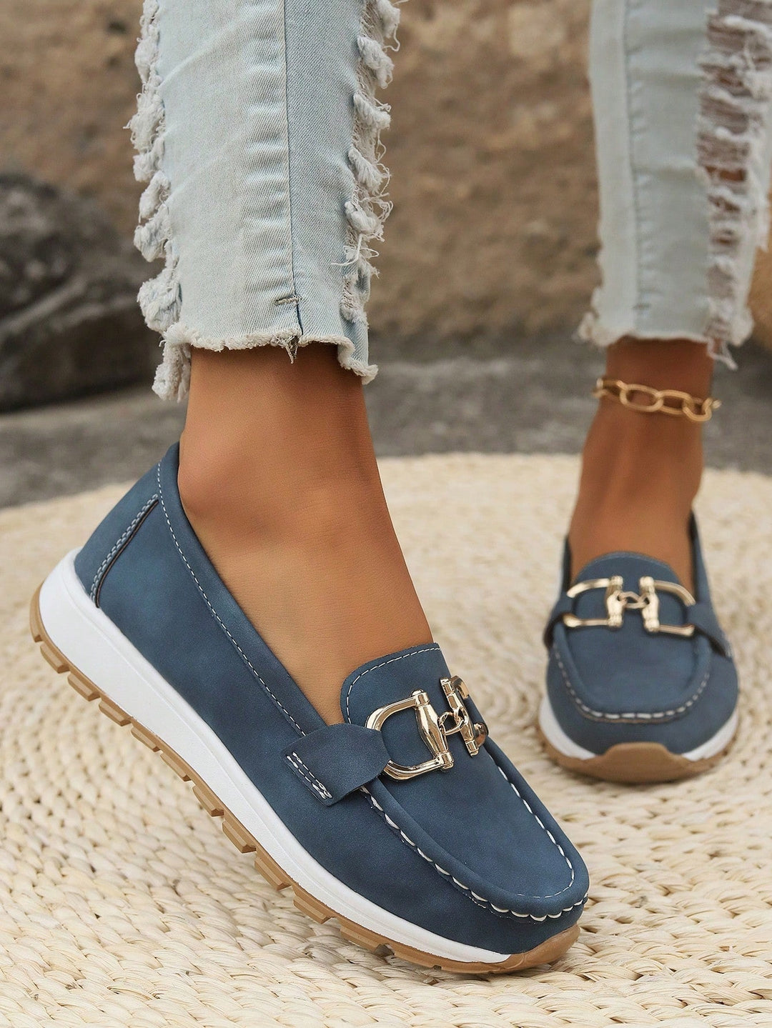 Women's gold buckle slip-on loafers. Offering everyday comfort and stylish versatile design.