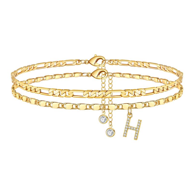 Personalized gold anklet with 'E' initial and crystal charm, adjustable for women, fashion accessory