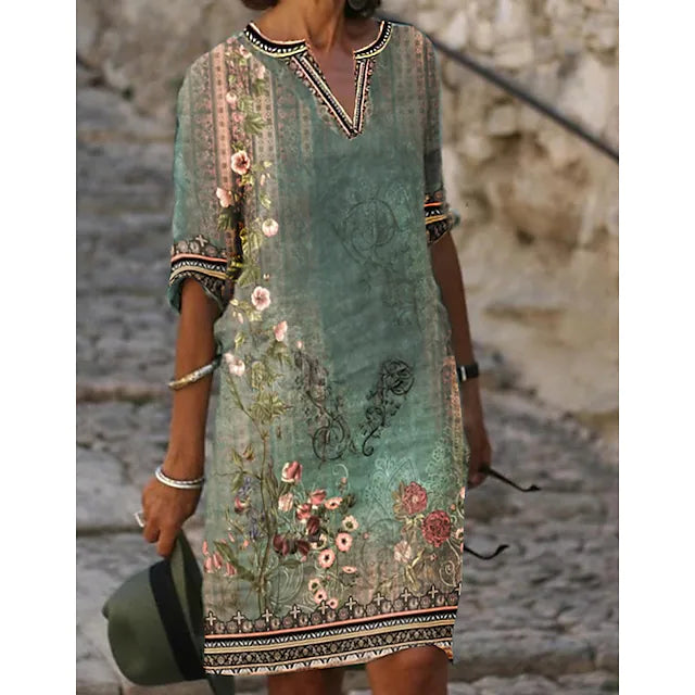 Women's green boho vintage floral midi dress with V-neck & short sleeves, perfect for summer casual or beachwear.