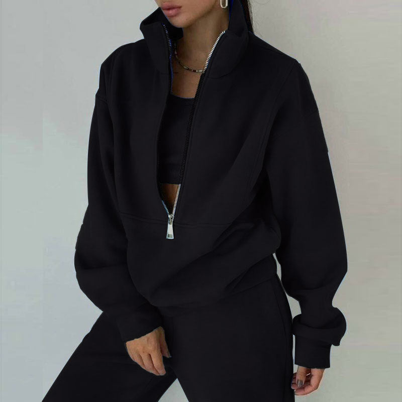 Relaxed fit women's half-zip loungewear set. High-waisted joggers & matching pullover for casual comfort & travel.