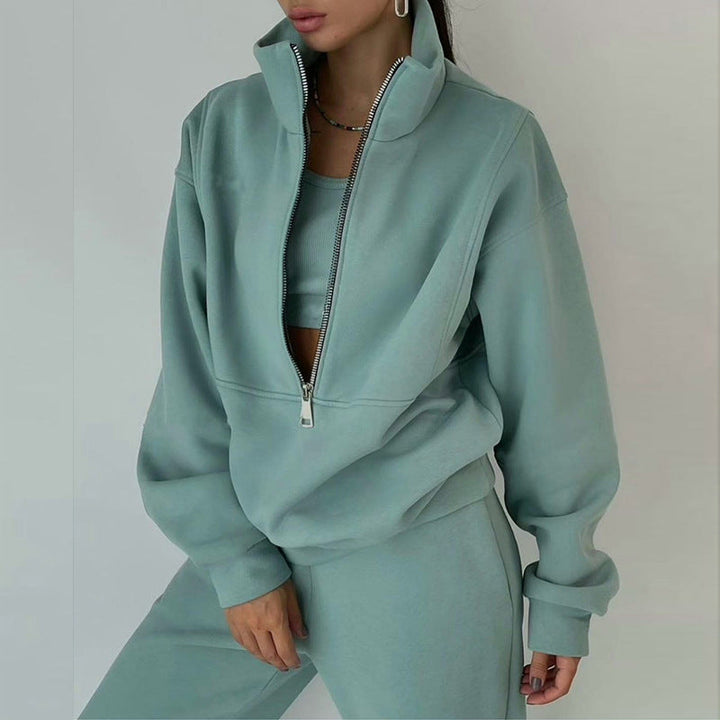 Trendy women's half-zip athleisure set. Comfortable high-waist joggers & pullover for travel, casual wear, & lounging.