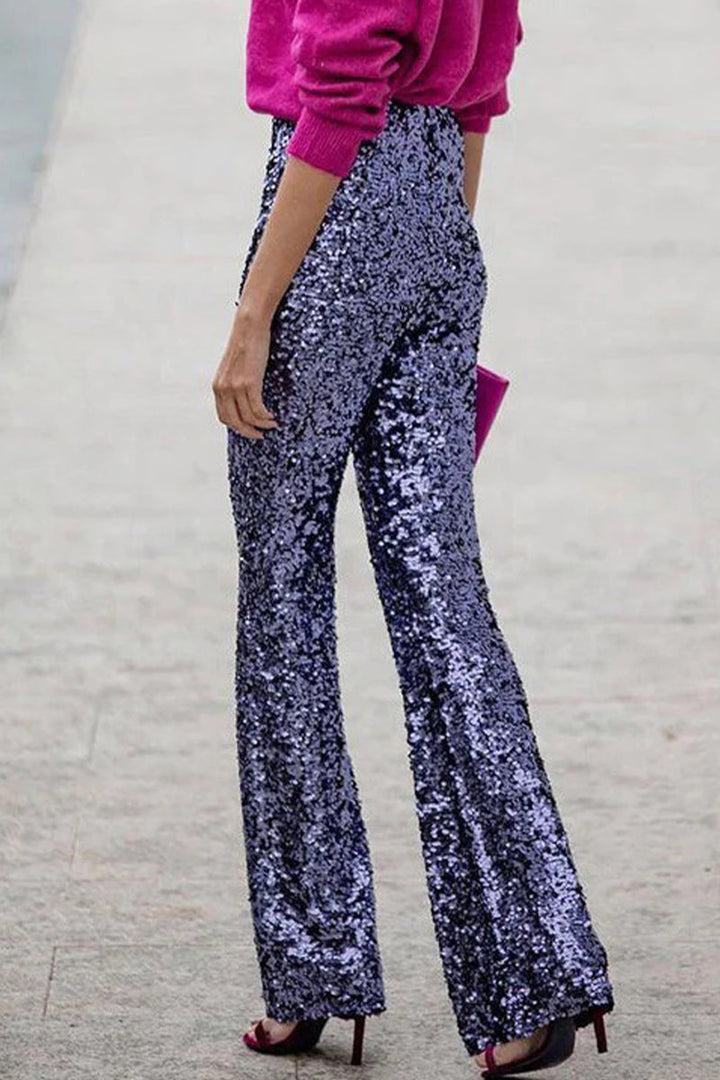 Festive women's apparel: evening wear sequin trousers with a flattering flared leg for celebrations.