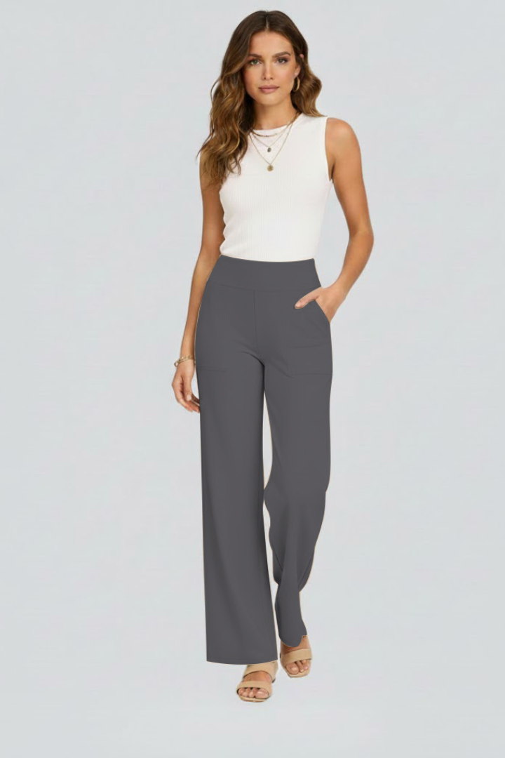 Woman in high-waist wide-leg pull-on trousers, highlighting relaxed fit, comfort & fashion.
