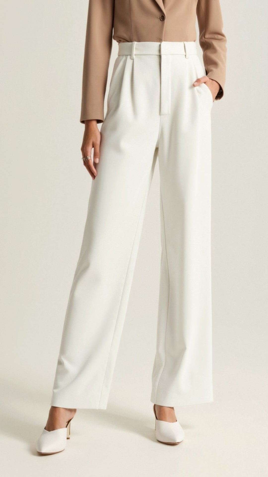 Model posing in high-waist wide-leg spring pants, showcasing their flattering cut and modern appeal.