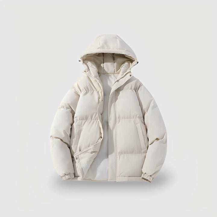 Side view of a woman wearing a blue insulated puffer jacket with a hood, ideal for cold weather.