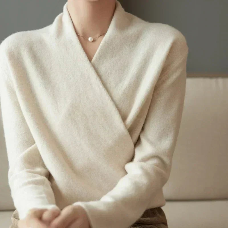 Woman modeling a stylish knit wrap neck spring top, perfect for everyday fashion