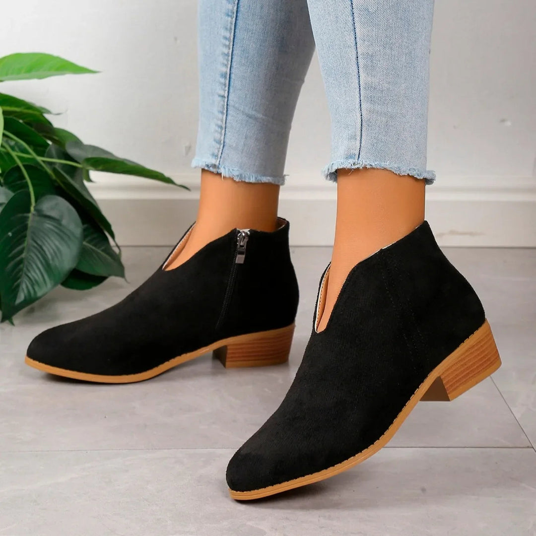 Top-down view of women's leopard print ankle boots, showcasing the full pattern and boot shape.