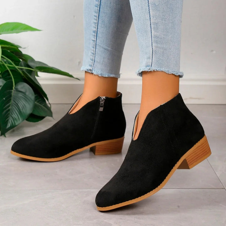 Top-down view of women's leopard print ankle boots, showcasing the full pattern and boot shape.