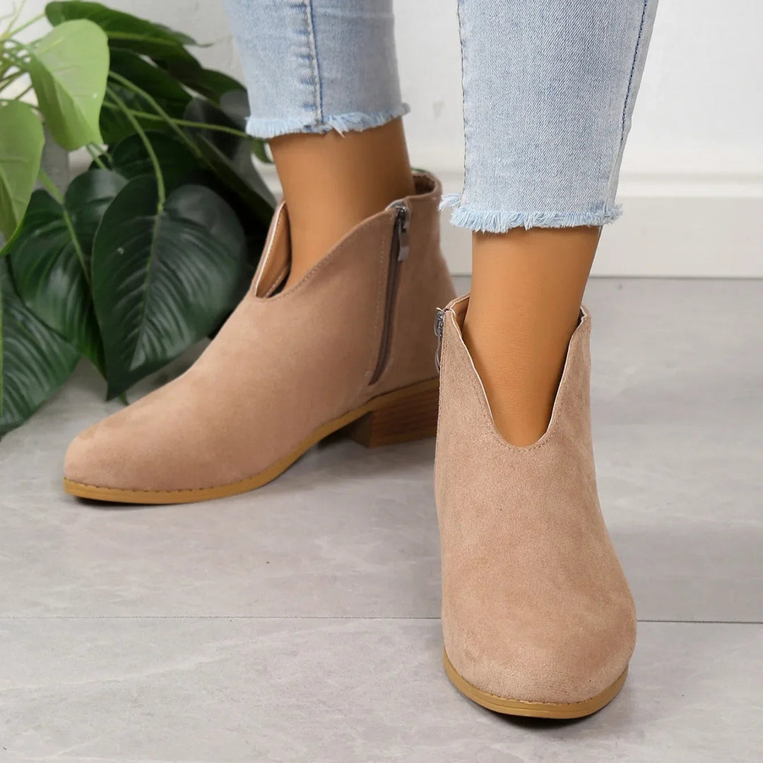 Women's animal print ankle boots with a practical zipper, a must-have for fall fashion.
