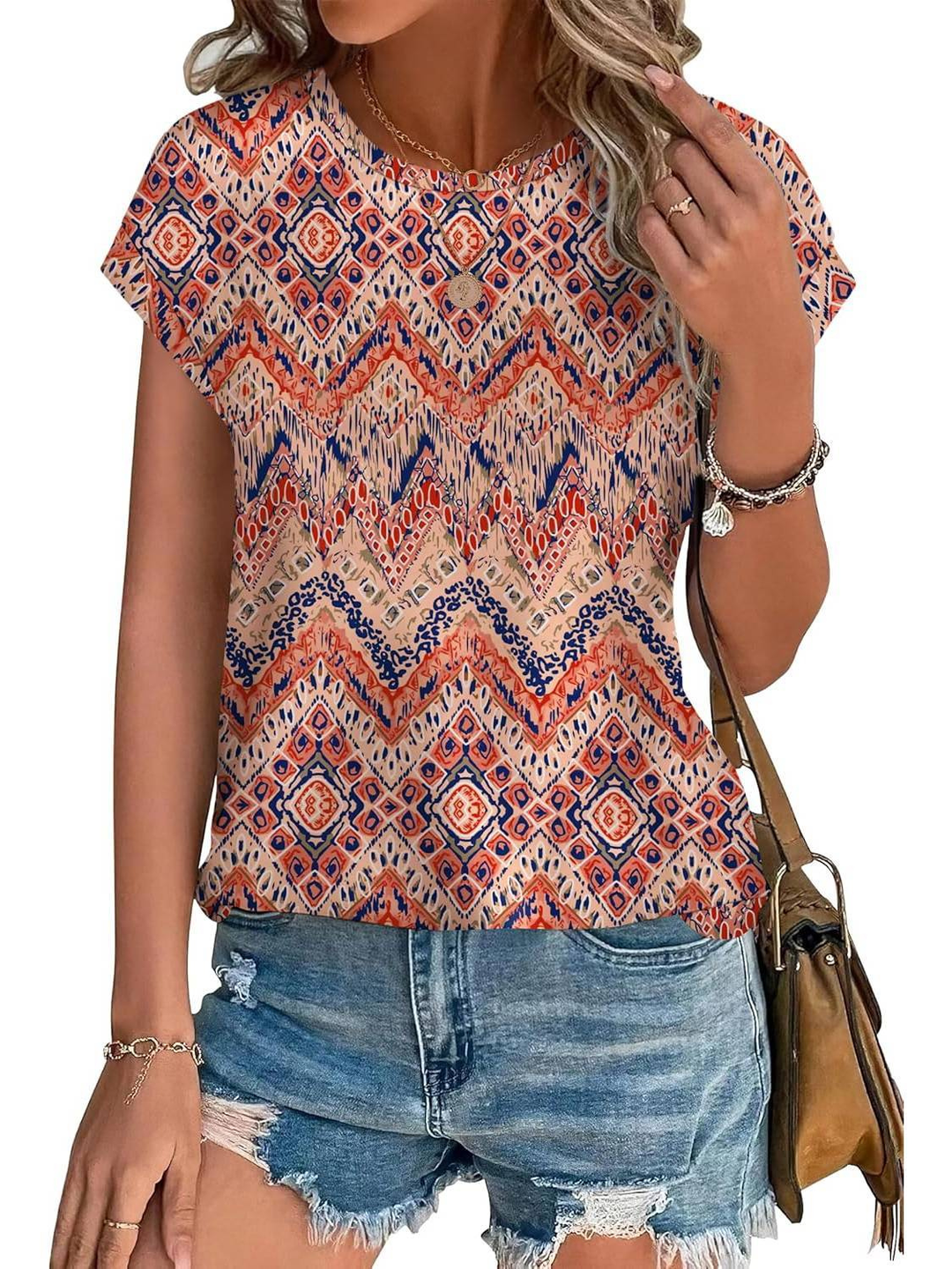 Crew neck women's cap sleeve top in a stylish botanical leaf print. Lightweight summer casual wear.