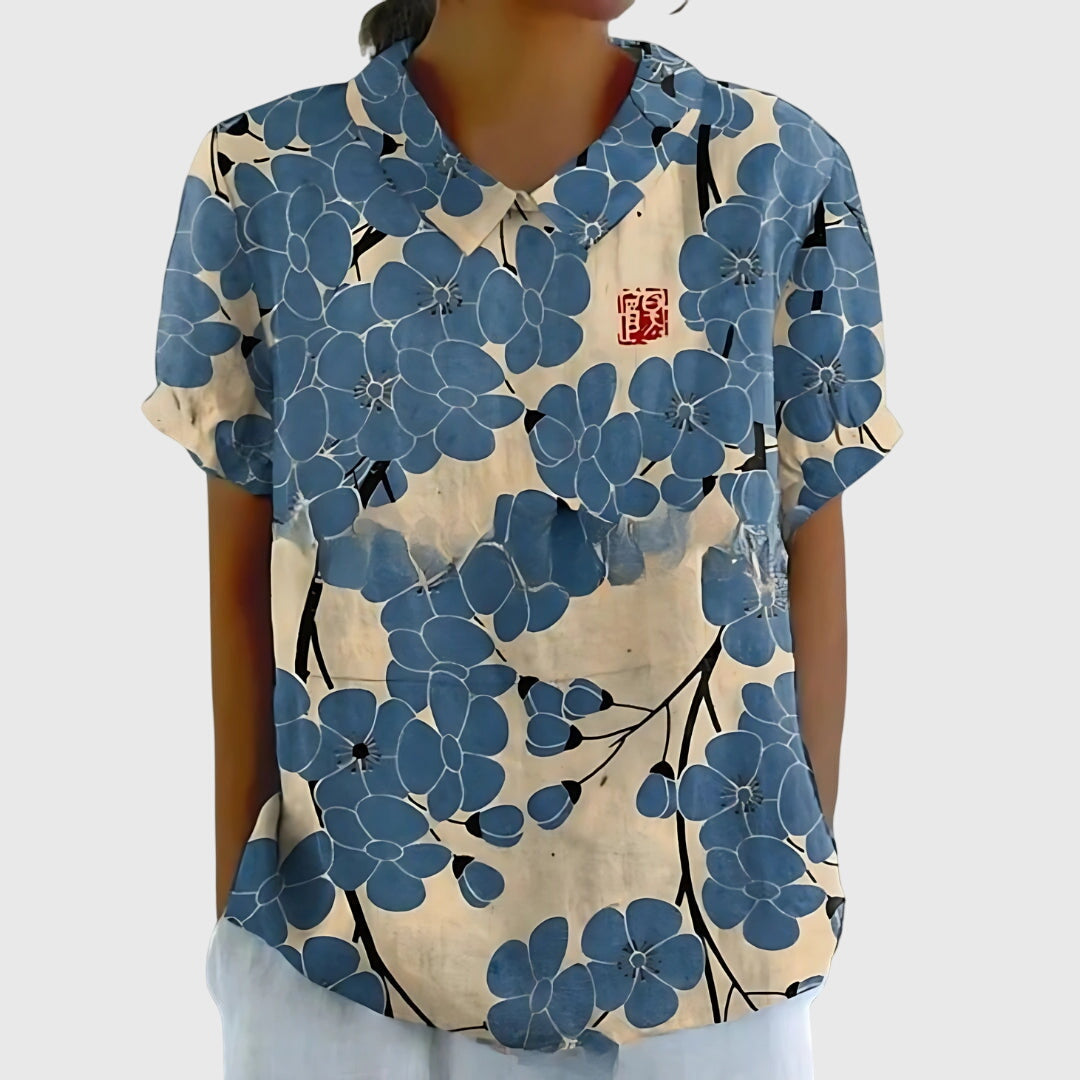 Comfortable women's floral blouse, ideal for everyday wear, shown on a model in a relaxed pose.