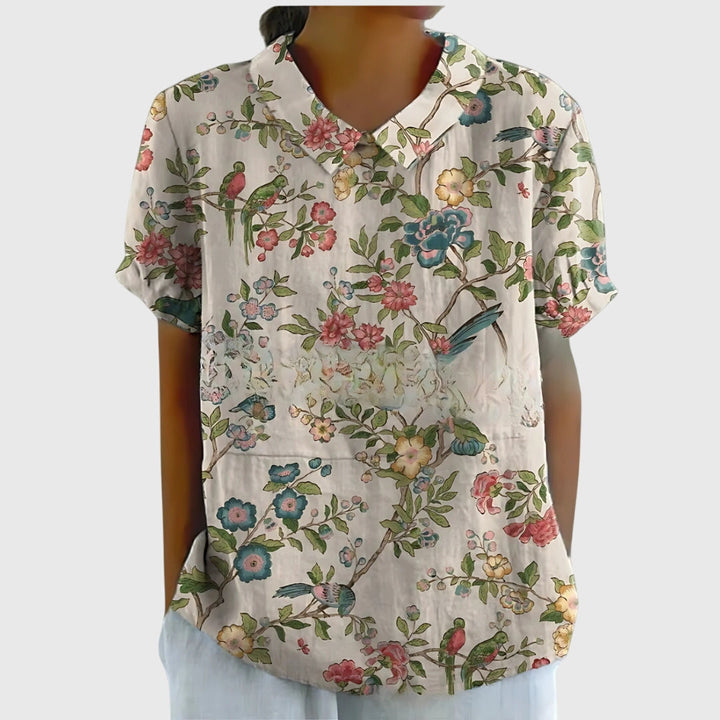 Detail of the comfortable sleeve on a women's lightweight floral top, perfect for summer fashion.