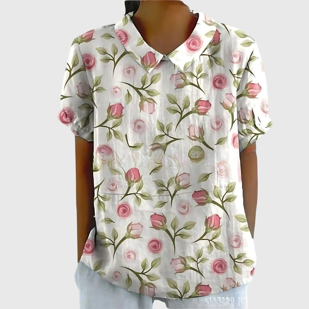 Elegant neckline of a women's floral blouse, designed for a relaxed, comfortable fit and casual wear.