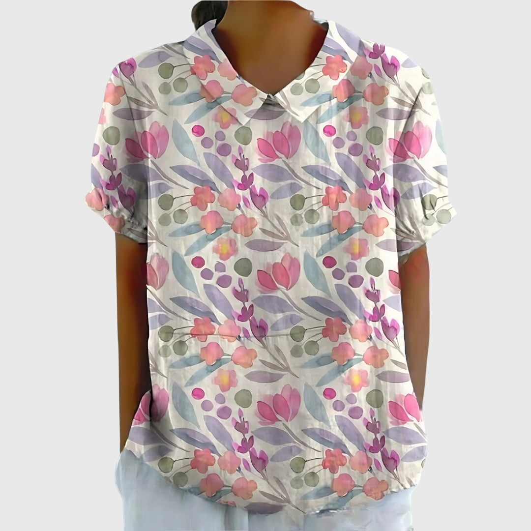 Elegant women's floral top paired with a skirt, perfect for spring fashion or a chic summer look.