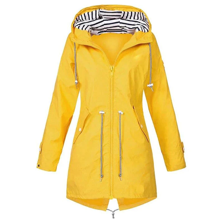 Full-length view of a women's lightweight hooded raincoat, ready for outdoor casual wear