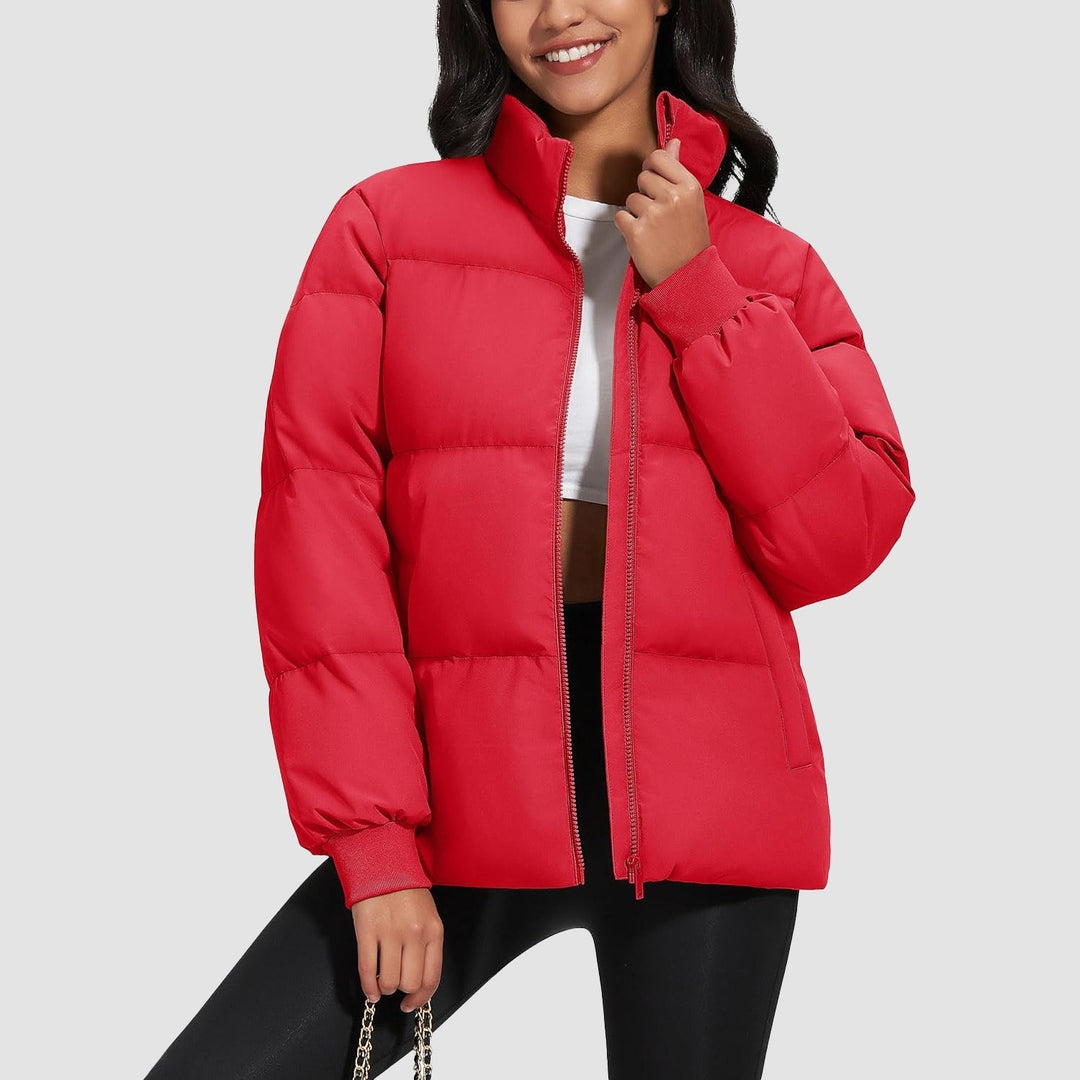 Black quilted women's jacket paired with jeans, casual and warm winter outfit idea