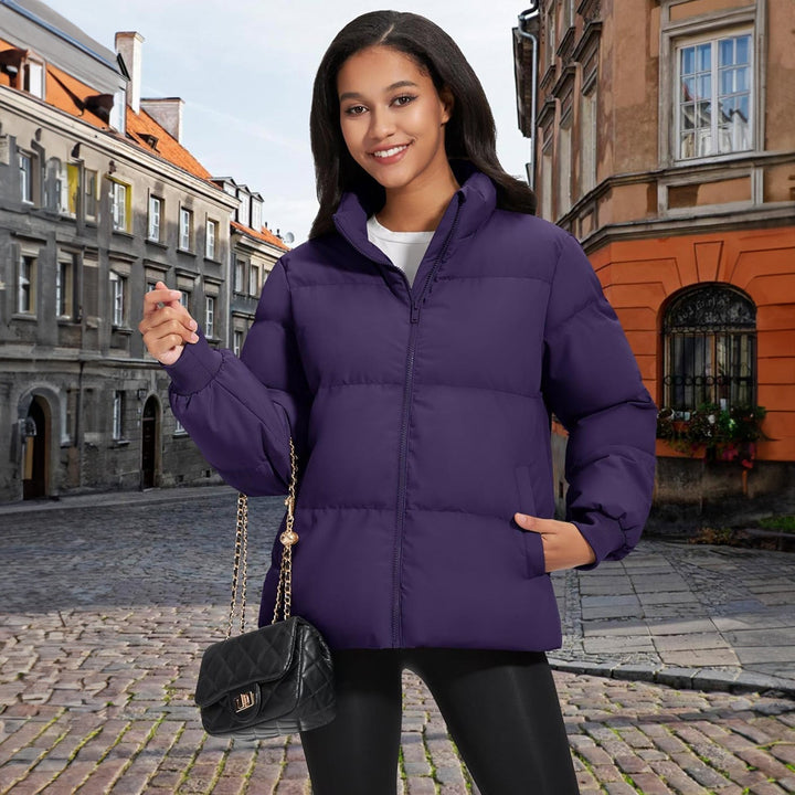 Hanging black lightweight puffer jacket, showcasing its clean lines and quilting