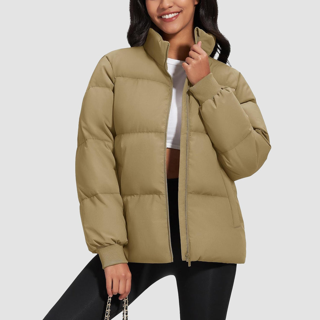Close-up of diamond quilting on a black women's puffer jacket, warm and insulated
