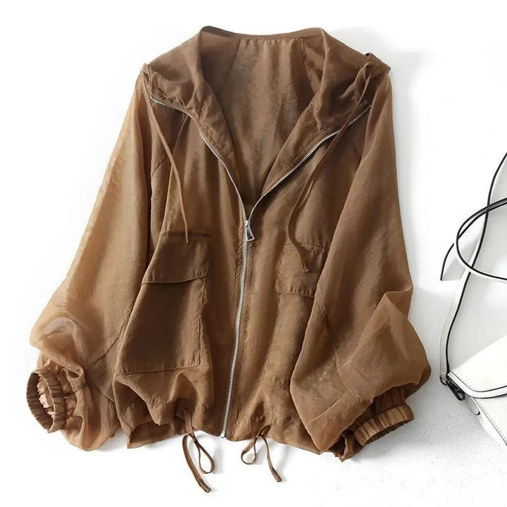 Women's lightweight summer sunscreen hoodie with UV protection. Ideal for outdoor layering & casual wear.
