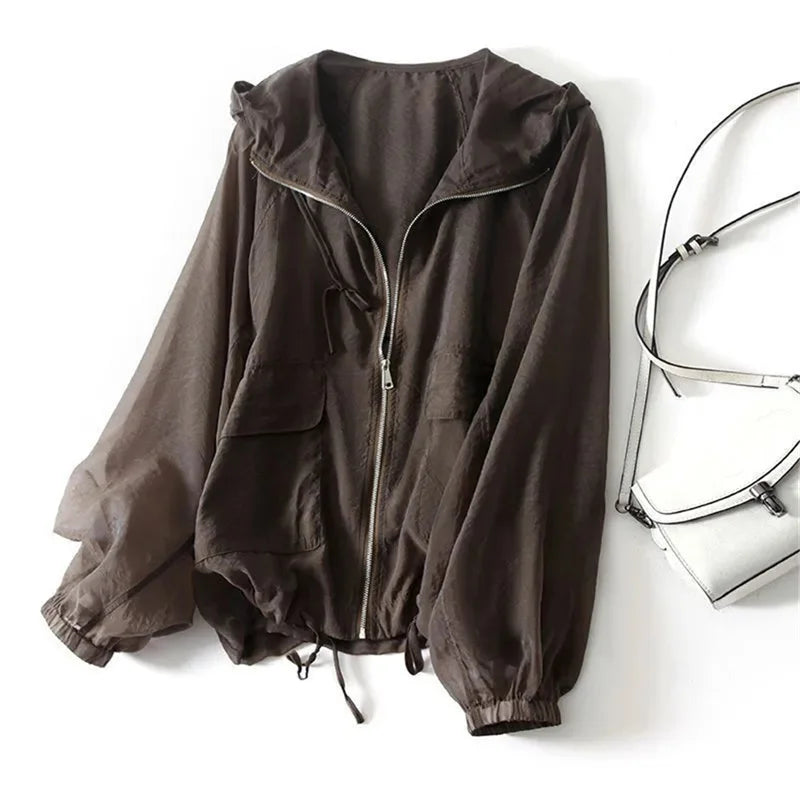 Casual women's summer hoodie for sun protection. Lightweight, full zip for outdoor activities & layering.
