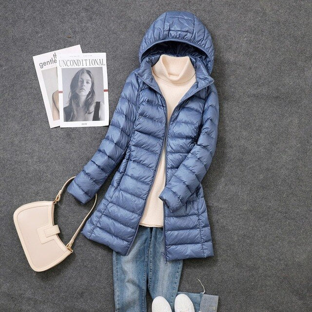 Cozy women's long puffer jacket, a stylish winter coat for women's fashion. Stay warm in cold weather.