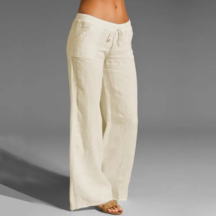 Women's loose fit linen casual trousers with elastic waist, perfect for comfortable summer vacation & everyday wear.