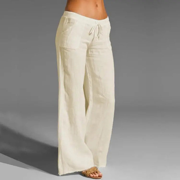 Women's loose fit linen casual trousers with elastic waist, perfect for comfortable summer vacation & everyday wear.