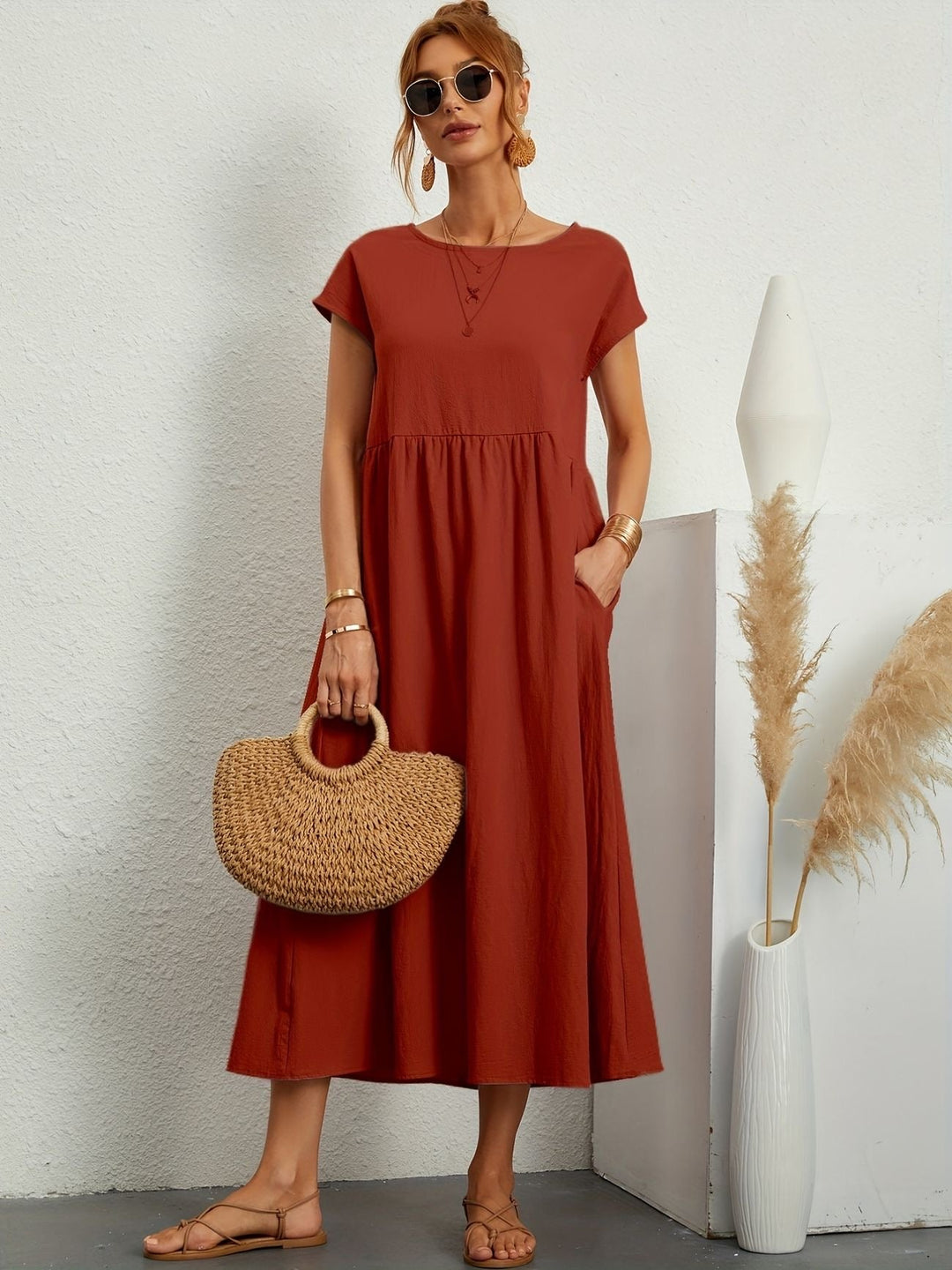 Versatile women's short sleeve maxi dress, loose fit with round neck and pockets for easy styling.