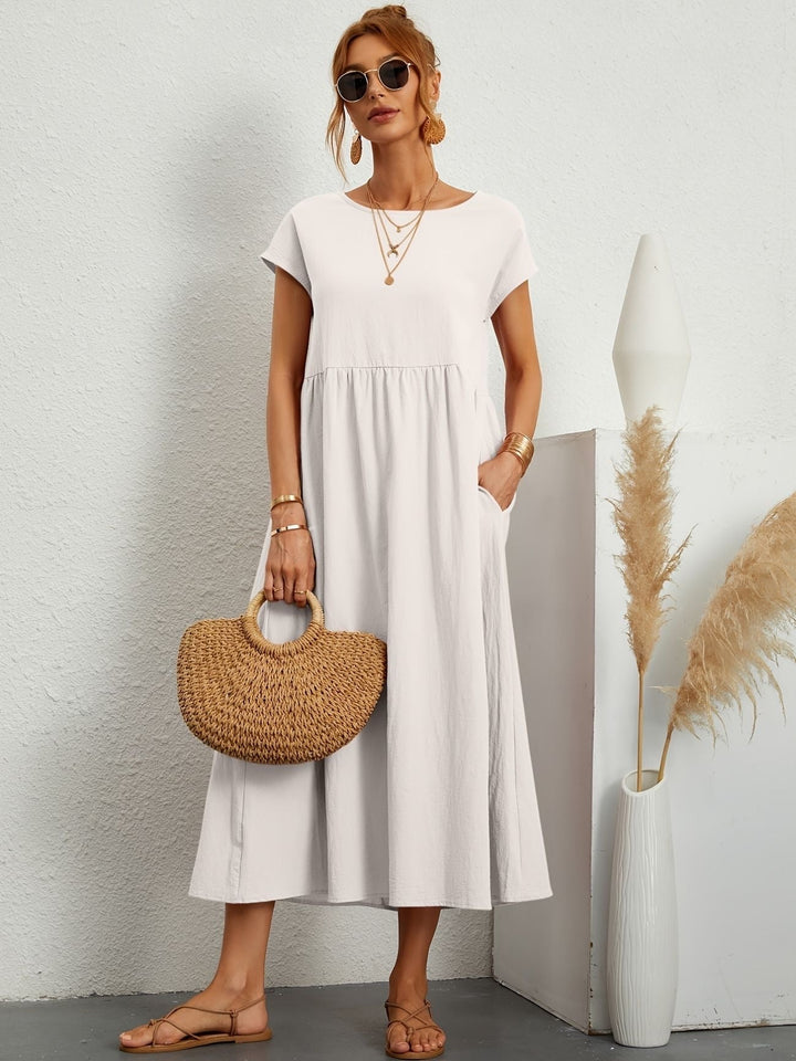 Stylish women's casual loose fit maxi dress, short sleeve with round neck and handy side pockets.