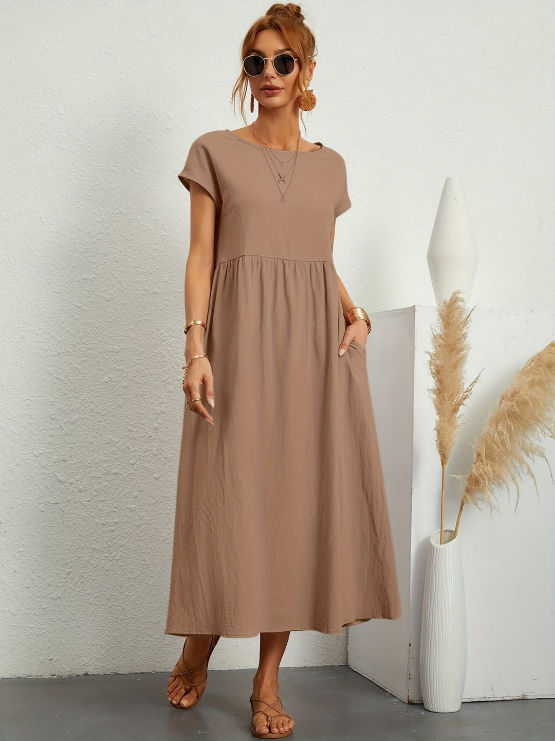 Elegant yet casual women's loose fit maxi dress, short sleeve, round neck, with useful pockets.
