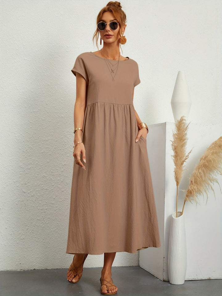 Elegant yet casual women's loose fit maxi dress, short sleeve, round neck, with useful pockets.